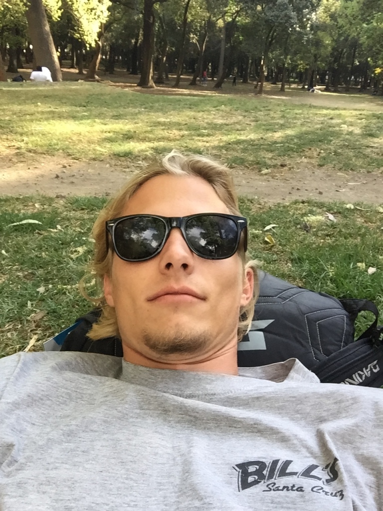Evan Quarnstrom rests in a park in Mexico City.