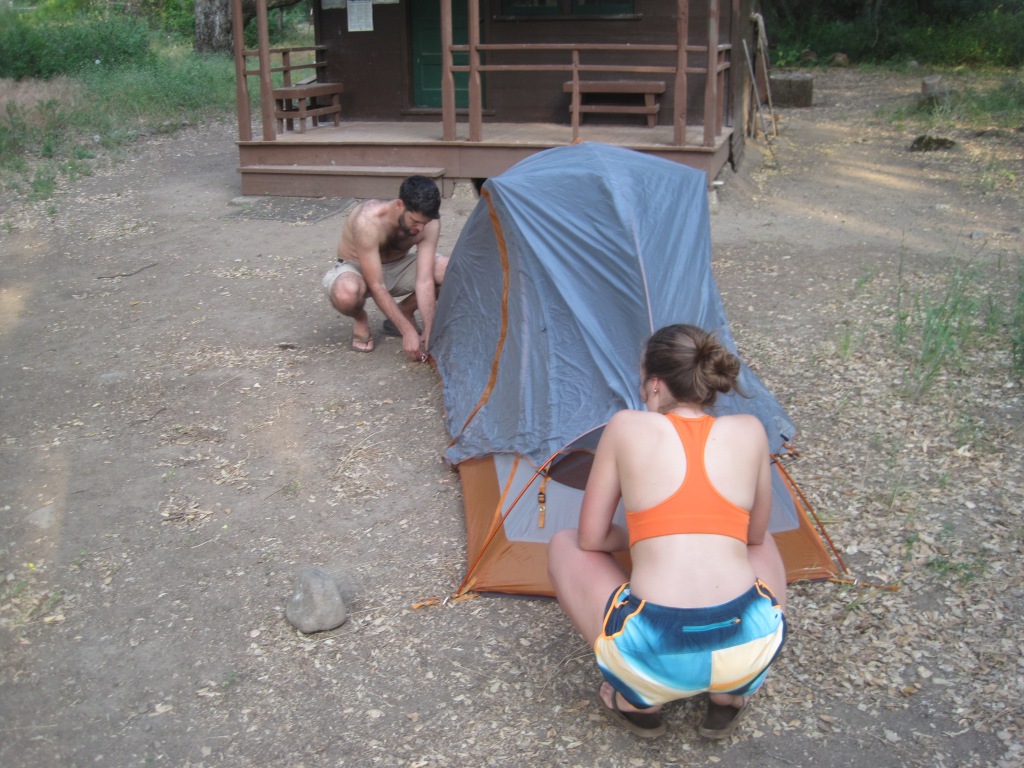 Kai Borer sets up a tent at Santa Cruz camp.