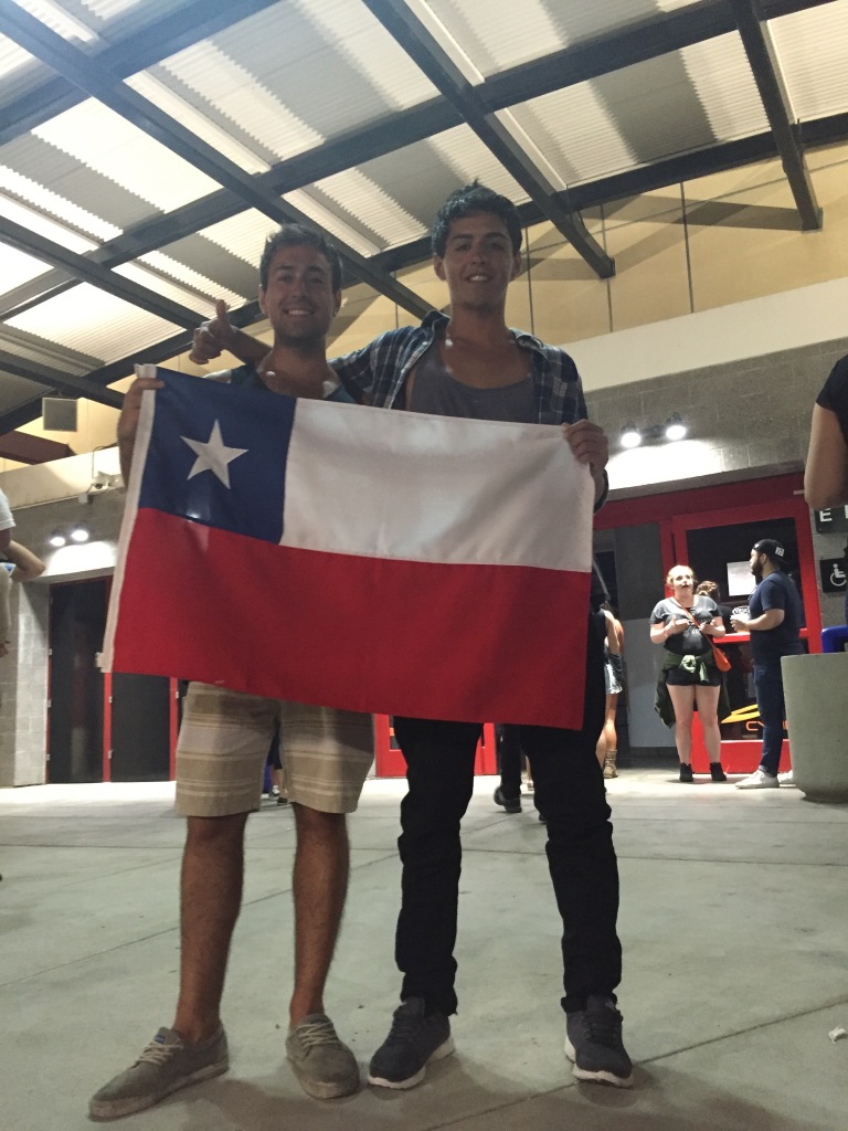Chileans take a photo with their flag at a concert in San Diego.