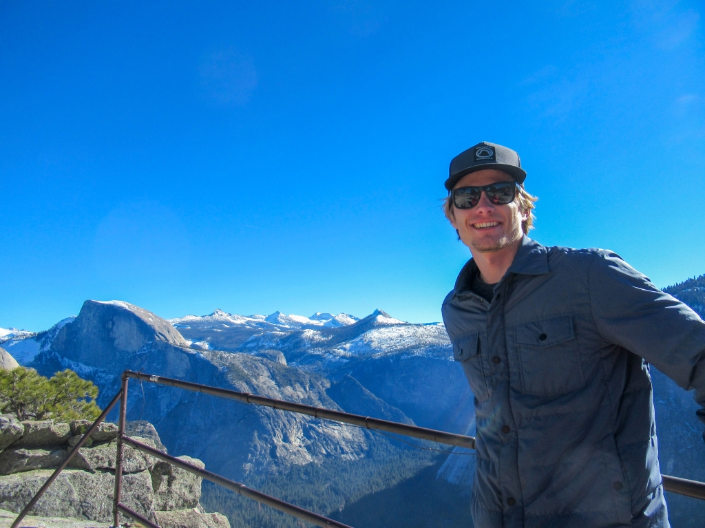 Evan Quarnstrom poses for a photo with Half Dome in the background.